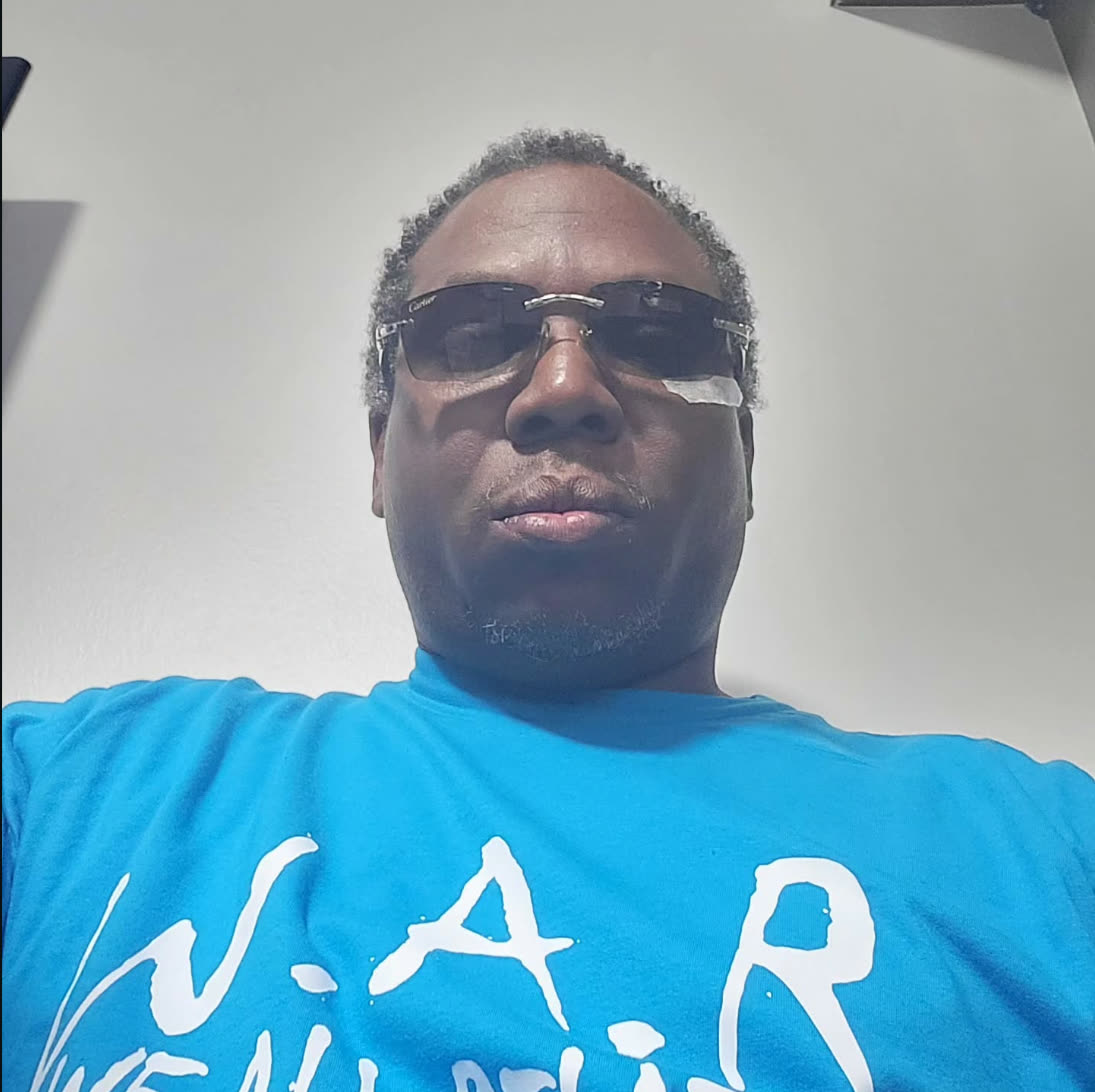 Bobby Swinney, founder of W.A.R., wearing a sky blue W.A.R. t-shirt
